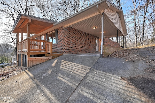 view of home's exterior featuring a carport