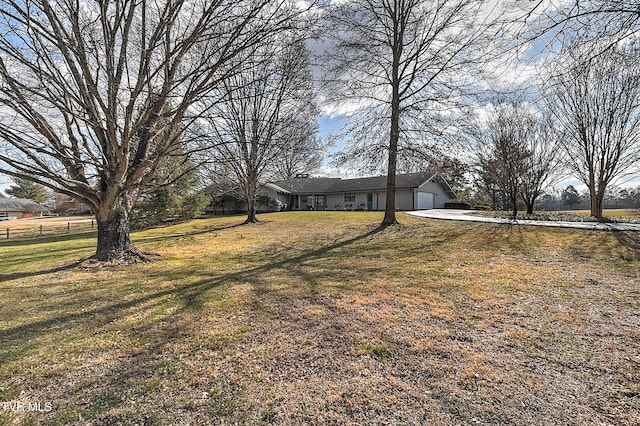 view of yard with a garage