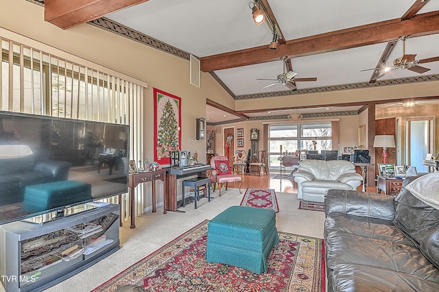 carpeted living room featuring lofted ceiling with beams and ceiling fan