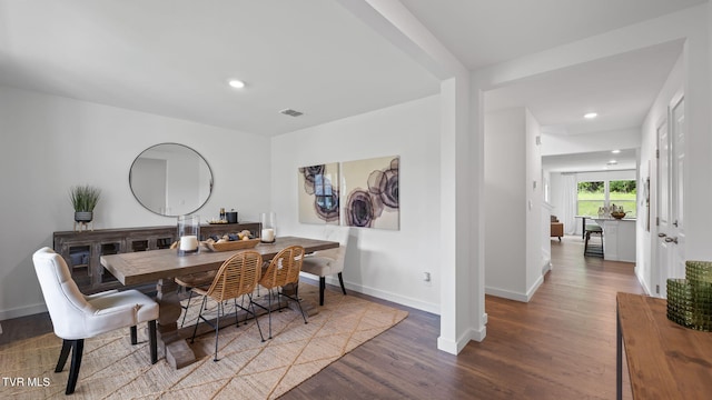 dining space featuring hardwood / wood-style flooring