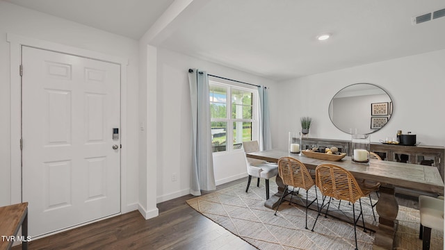 dining space featuring dark hardwood / wood-style floors