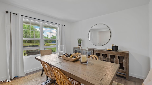 dining room with hardwood / wood-style flooring