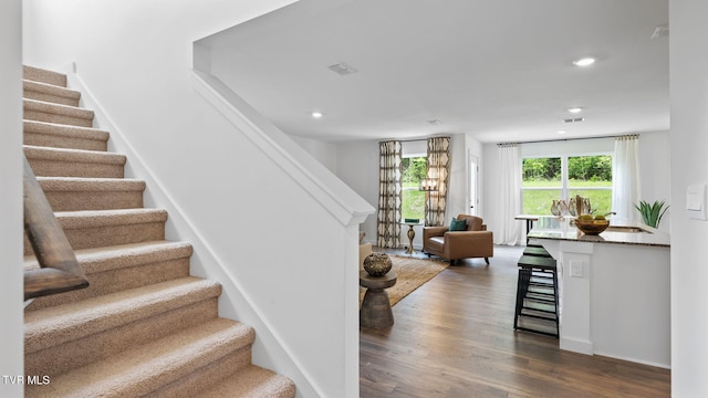 staircase featuring hardwood / wood-style flooring