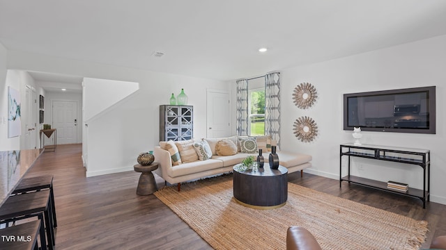 living room with dark wood-type flooring