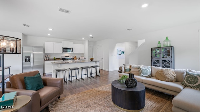 living room with dark hardwood / wood-style floors