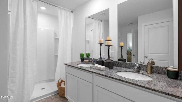 bathroom with vanity and a shower with shower curtain