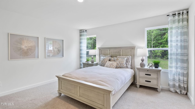 bedroom with light carpet