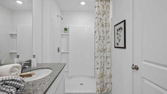 bathroom with vanity and curtained shower