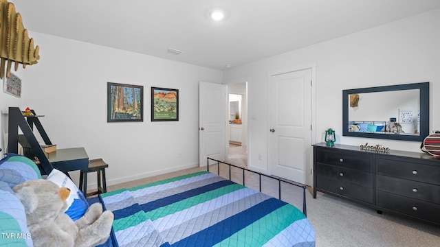 bedroom with light carpet