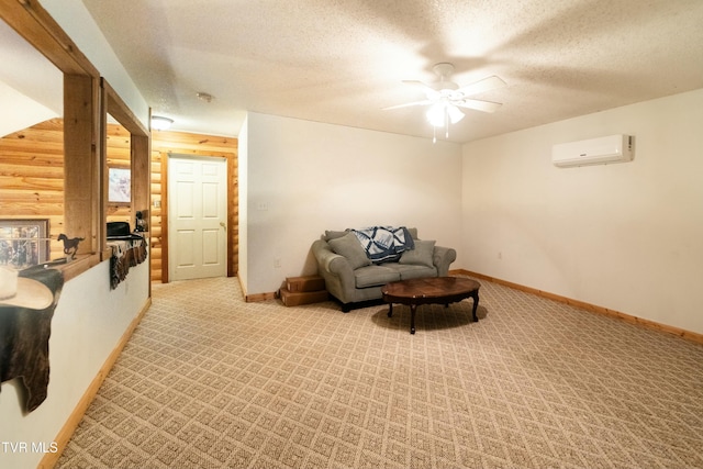 sitting room featuring ceiling fan, a wall mounted AC, light carpet, and a textured ceiling