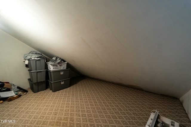 bonus room featuring lofted ceiling and light carpet