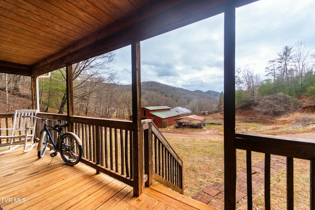 wooden deck with a mountain view