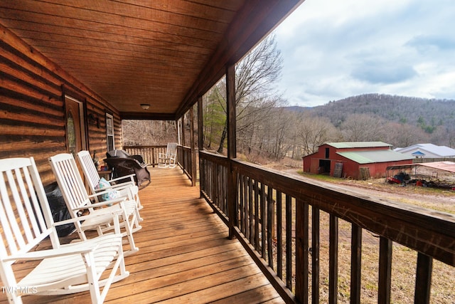 wooden terrace featuring a mountain view