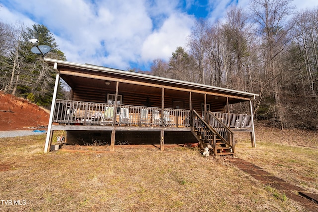 view of front of property featuring a wooden deck