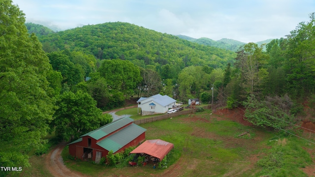 109 Triangle B Dr, Erwin, TN 37650 - aerial view of property and surrounding area with a heavily wooded area and a mountain backdrop