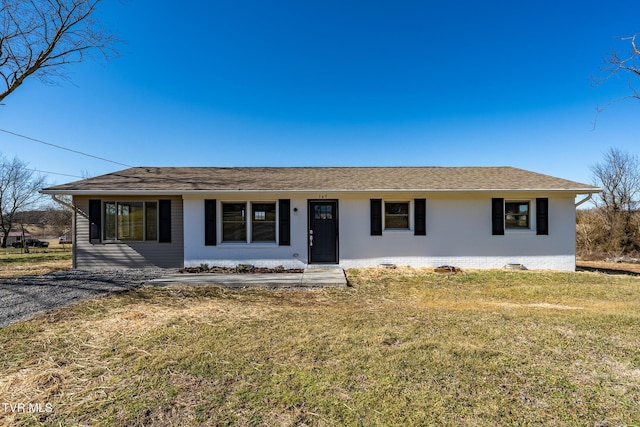 ranch-style home with a front yard