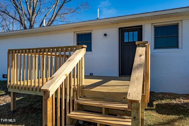 doorway to property featuring a deck