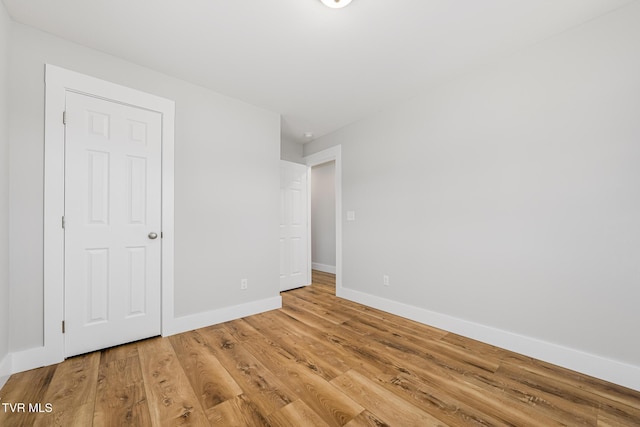 unfurnished room featuring wood-type flooring