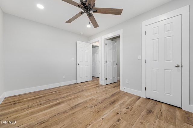 unfurnished bedroom with light hardwood / wood-style floors and ceiling fan