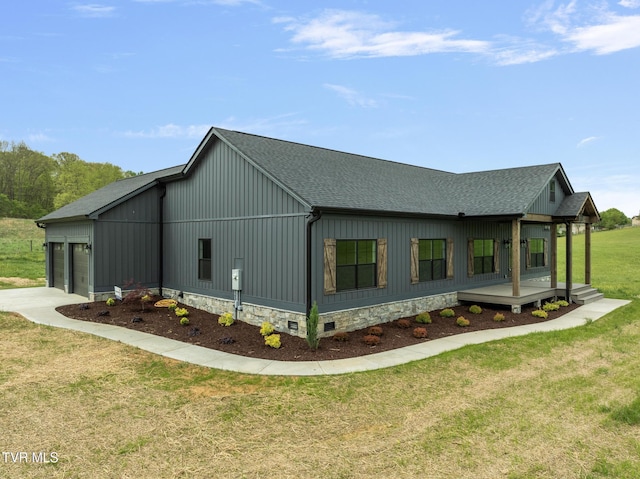 view of property exterior featuring roof with shingles, concrete driveway, a lawn, and a garage