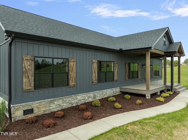 view of property exterior featuring roof with shingles