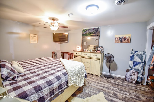 bedroom with ceiling fan and light wood-type flooring