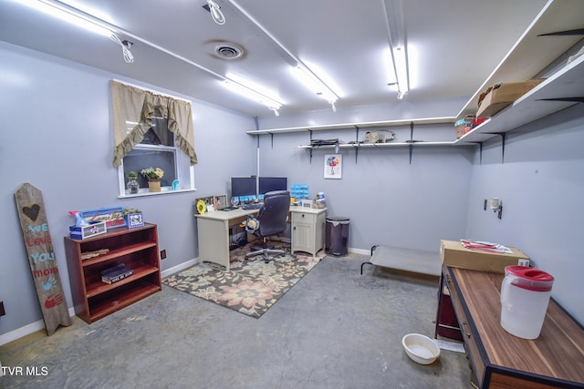 office area with concrete floors