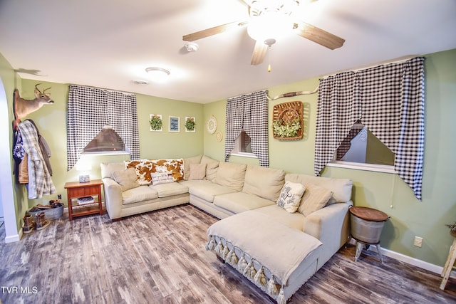 living room with ceiling fan and hardwood / wood-style floors