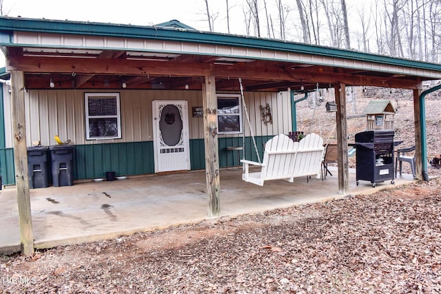 doorway to property with a patio