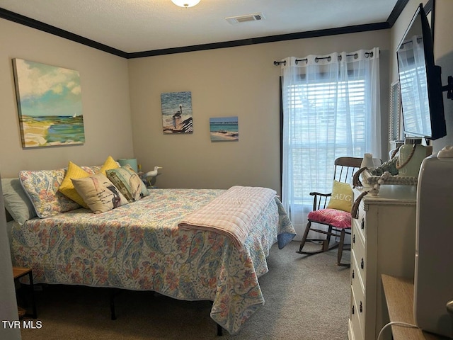 bedroom featuring ornamental molding and carpet