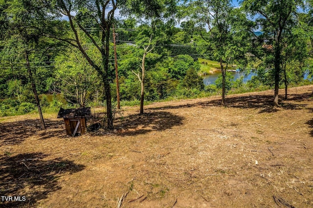 view of landscape with a water view