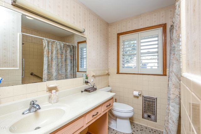 bathroom featuring walk in shower, toilet, heating unit, tile walls, and vanity