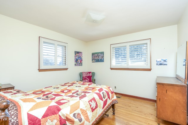 bedroom with light wood-type flooring