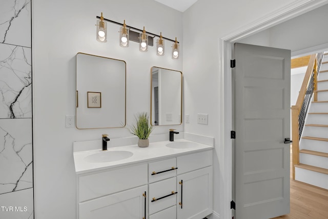 bathroom with vanity and hardwood / wood-style floors