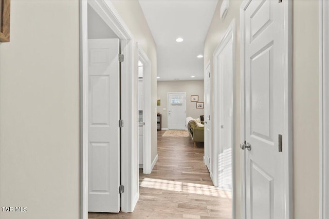 hall with light wood-type flooring