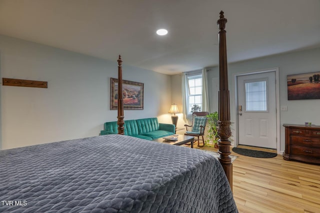 bedroom with hardwood / wood-style flooring