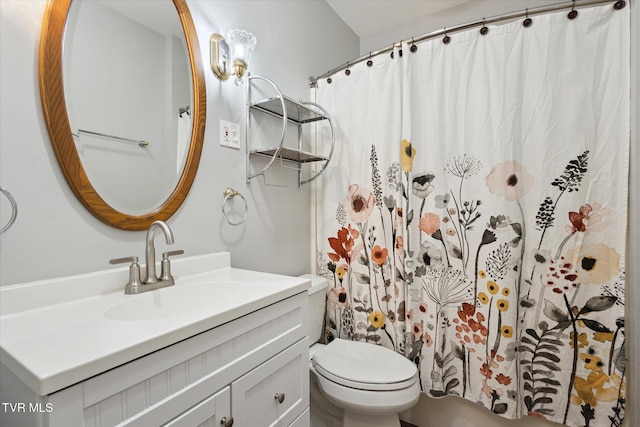 full bathroom with toilet, curtained shower, and vanity