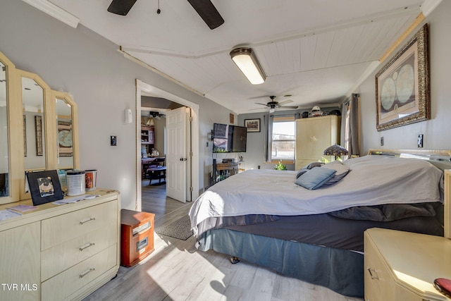 bedroom with light hardwood / wood-style floors and ceiling fan