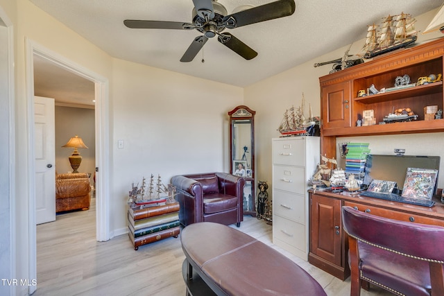 home office featuring ceiling fan and light wood-type flooring