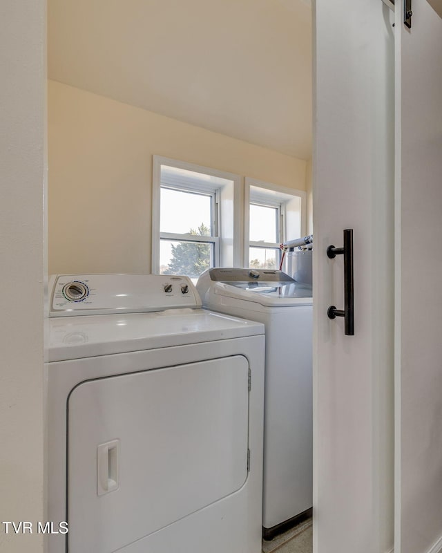 washroom featuring washing machine and dryer