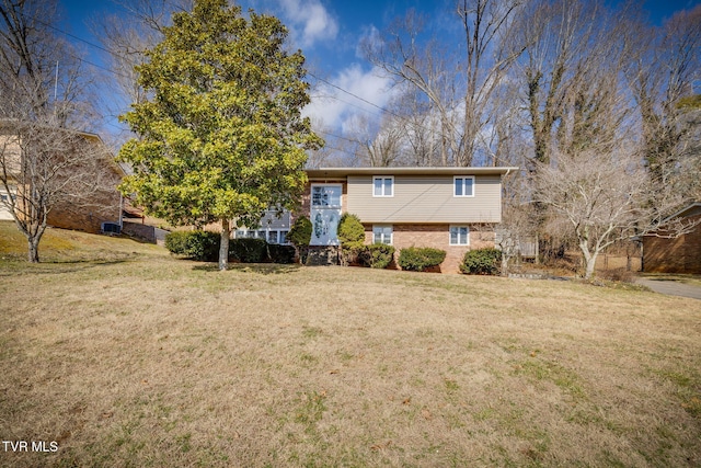 rear view of property featuring a yard