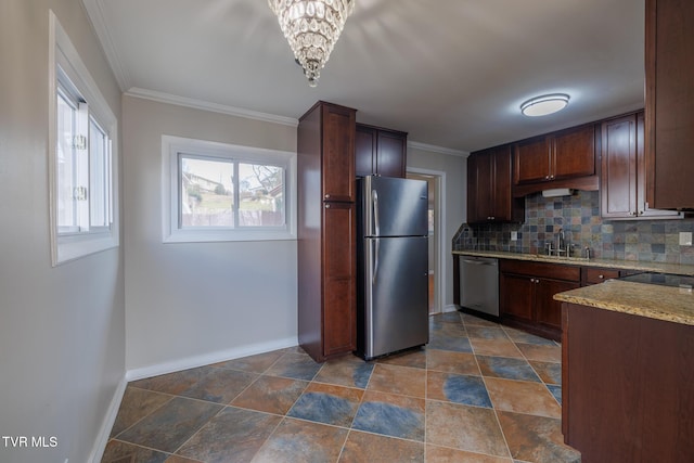 kitchen with dark brown cabinetry, sink, crown molding, appliances with stainless steel finishes, and decorative backsplash