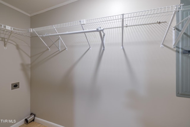 laundry room with ornamental molding and hookup for an electric dryer