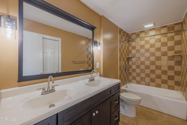 full bathroom featuring tiled shower / bath, tile patterned floors, toilet, and vanity