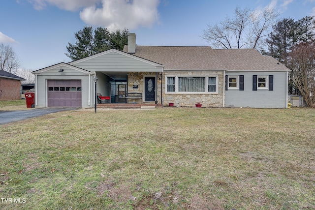 ranch-style house with a garage, driveway, a chimney, and a front lawn