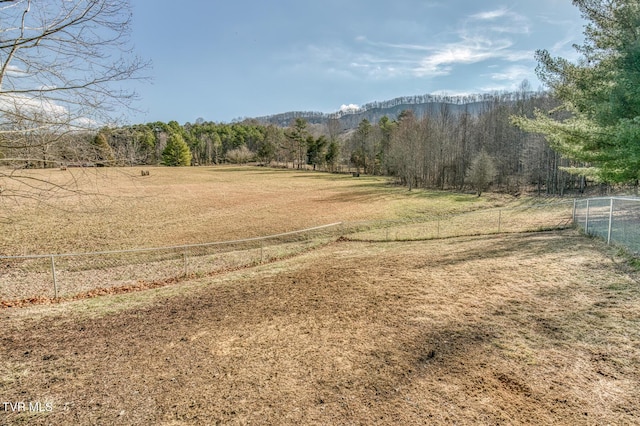 exterior space featuring a yard and a rural view