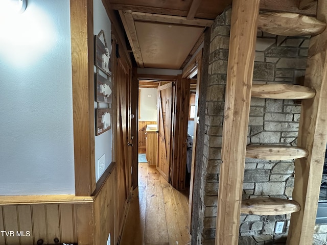 corridor with light hardwood / wood-style flooring