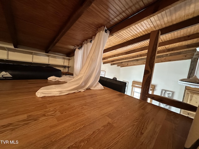 interior space with beamed ceiling and wooden ceiling