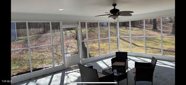 sunroom with ceiling fan and a wealth of natural light