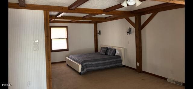 bedroom with light carpet, baseboards, visible vents, and beamed ceiling